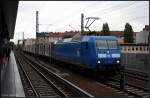 PRESS 145 030-7 ist bei Schmuddelwetter mit einem Holzzug Richtung ...
