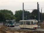 potsdam Der historische Triebwagen 177 (Gotha-Gelenkwagen) wird von Tatra-Doppel 123/124 verfolgt. Hier schl�ngeln sich beide die neue Streckenf�hrung am Alten Markt entlang. Am Zielschild des Traditionswagens steht 'Prof.-Ludschuweit-Allee', der alte Name der heutigen Kastanienallee. Potsdam, 2009-10-03.