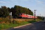 Im sch�nsten Abendlicht durcheilt 11 218-4 Creidlitz am 23.09.09  ...