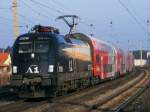 1x16-werbeloks 1116.280 'A1' am 28.12.2008 im Bahnhof Neunkirchen N� mit einem Regionalzug aus Wien nach Payerbach-Reichenau.
