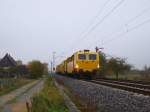 Stopfmaschinen Ein Schienenstopfer f�hrt durch die BK Basheide. Aufgenommen am 29.10.2009