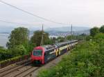 S-Bahn Zurich Re 450 087-2 mit Werbung 'BLICK' am 21.5.05 kurz vor Thalwil. 