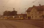 Filderbahn Stuttgart - Vaihingen Im Oktober 1980 war die Filderbahn fast noch mehr Schmalspurbahn als Stra�enbahn und sicher keine Stadtbahn. Das Bahnhofsgeb�ude in M�hringen, der rotbem�tzte Aufsichtsbeamte, die elektrischen G�terzuglokomotiven...all dies erinnert an eine Epoche, die dem heutigen modernen Stadtbahnbetrieb gewichen ist.  
