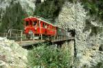 strecke-arosabahn-ch-a RhB EXTRA-GmP f�r GRAUB�NDEN TOURS 3658 von Arosa nach Chur am 31.08.1997 auf Castieler Tobel-Viadukt mit Bernina-Triebwagen ABe 4/4I 32 - B 2247 - D� 4052I - Xk 9398 - Kkl 7052 - E 6623.
