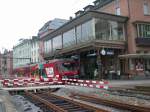 AB RHB Rorschach-Heiden-Bergbahn BDeh 3/6 wartet vor dem Hafenbahnhof Rorschach auf die Abfahrt. Das dar�berliegende Restaurant bietet einen guten Blick auf die Z�ge und ebenfalls auf die Schiffe auf dem Bodensee.(12.04.2005)
Zur Zeit ist das Hafenrestaurant leider geschlossen.