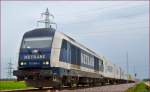 METRANS 761 004 zieht Containerzug durch Cirkovce Richtung Koper Hafen. /17.4.2014