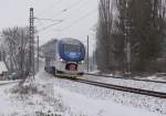 844 001-8 mit dem Os 7011 von Cheb nach Chomutov hier am 04.01.16 in Nebanice.