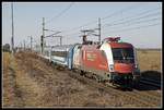 470 004 mit Schnellzug bei Gramatneusiedl am 27.02.2019.