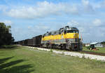 312 passes South Bay whilst hauling BT1, empty sugarcane cars from Clewiston to Bryant, 14 Feb 2020.

506 is being hauled in the consist...