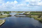 501 crosses the swing bridge at Moore Haven whilst hauling an emty sugarcane train, 14 Feb 2020