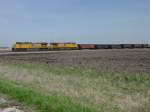 Union Pacific 5988 & 5561 pull an empty coal train on the BNSF double track main line westbound near Middletown, Iowa on 15 Apr 2005.