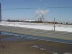 9 Locomotives and over 200 freight cars rumble down the westbound track and pass the ethanol plant near Middletown, Iowa. 3 Mar 2010