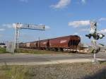 Ein Bahnbergang in Sealy (bei Houston, Texas) wurde gerade von einem langen Gterzug berquert. Aufgenommen am 13.11.2007.