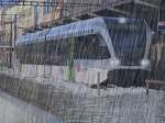 verfremdete-fotos Thurbo GTW 2/6 741-4 in Konstanz bei Hochwasser und str�mendem Regen.