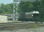 Zuge Private coach on the back of an Amtrak train rounding the last curve before crossing the Mississippi River. 