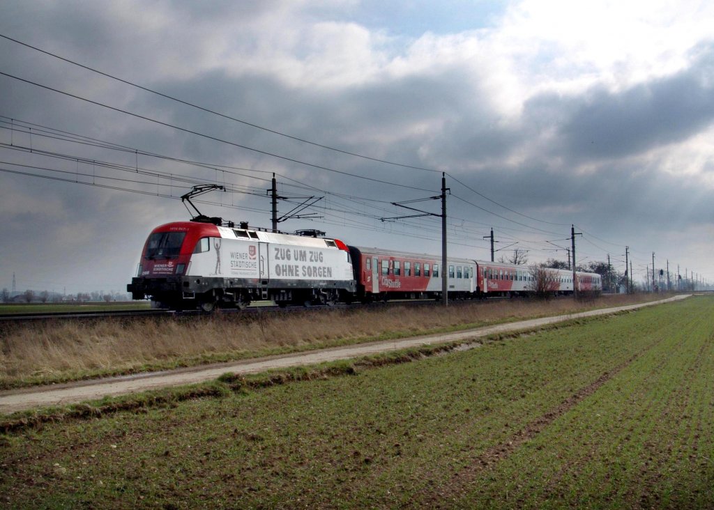 1016 047 mit einem REX am 28.03.2008 unterwegs bei Gunskirchen.