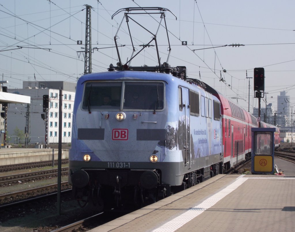 111 031-1  Olympia  erreicht am 21. April 2011 mit einem RE aus Mnchen Hbf den Nrnberger Hbf auf Gleis 12.