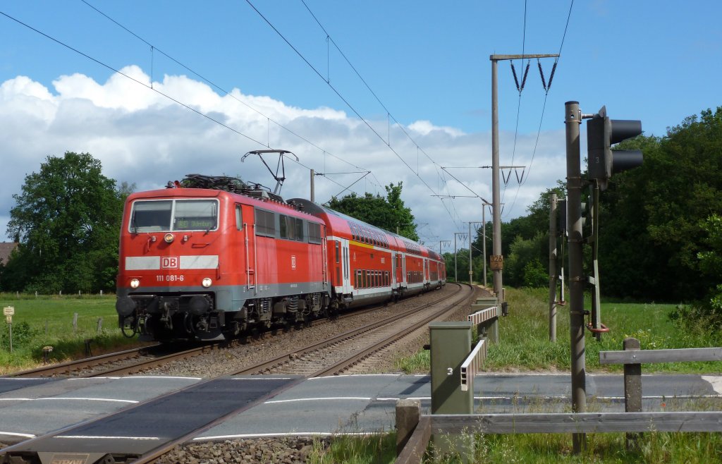 111 081-6 am 02.06.2012 mit einem RE von Emden nach Mnster, hier bei Eisinghauen.