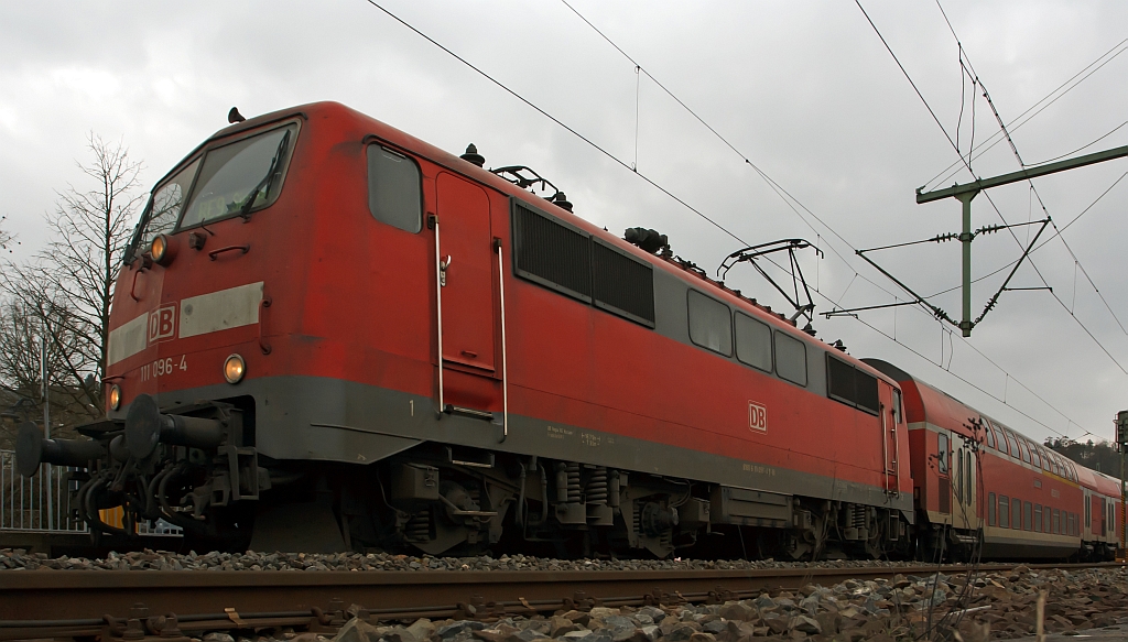 111 096-4 mit dem RE 9 (Rhein-Sieg-Express) Aachen - Kln -Siegen, hier am 04.03.2012 beim Halt im Bahnhof Betzdorf/Sieg.