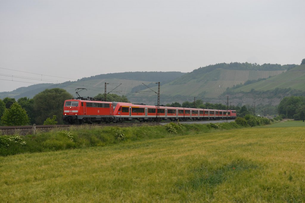 111 177 mit einem RE nach Wrzburg am 02.06.2012 unterwegs bei Himmelstadt.