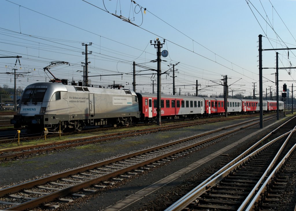 1116 038 mit einem REX nach Passau am 08.04.2009 bei der Ausfahrt in Linz.