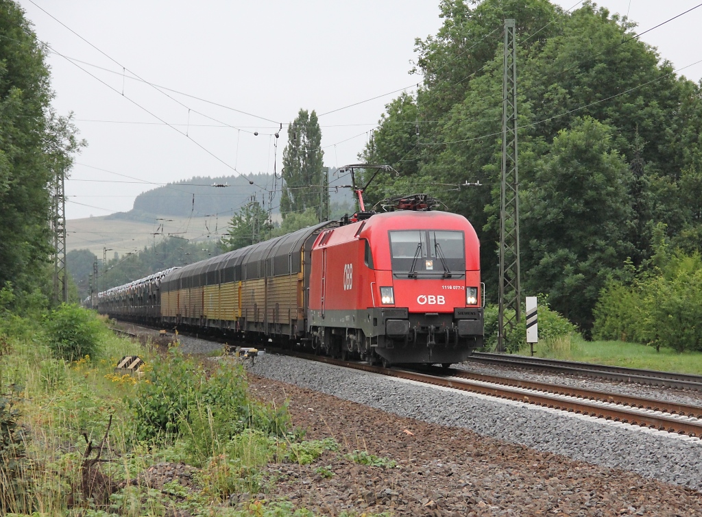 1116 077-7 bespannte am 05.07.2011 einen TXL BMW-Zug in Richtung Norden. Aufgenommen am B Eltmannshausen/Oberhone.