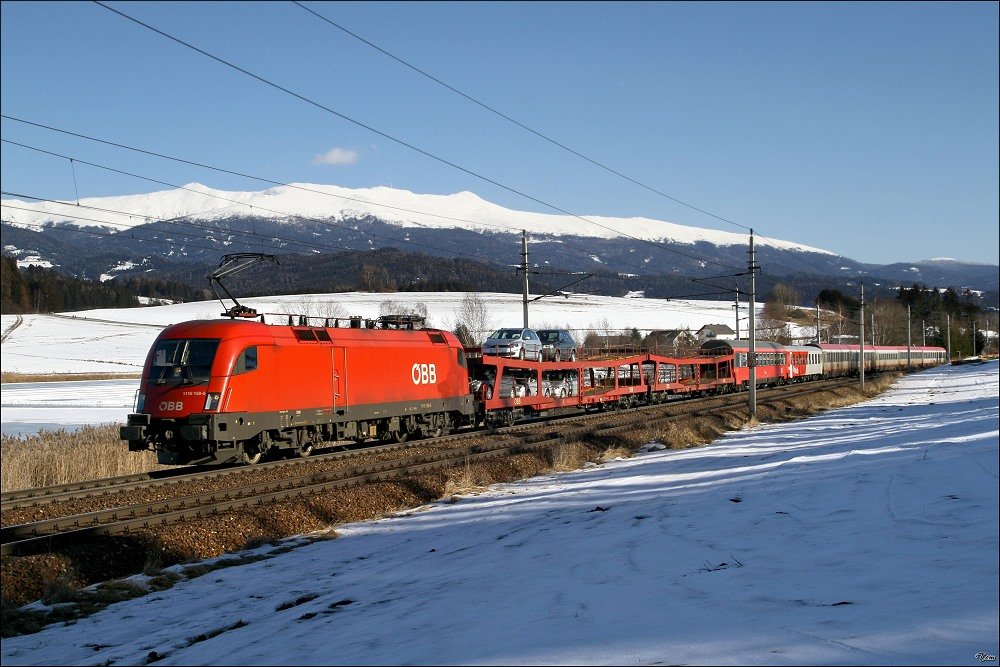 1116 158 fhrt mit EC 732 von Villach nach Wien.
Im Hintergund sieht man den Furtner Teich und die Seetaler Alpen.
21.02.2010