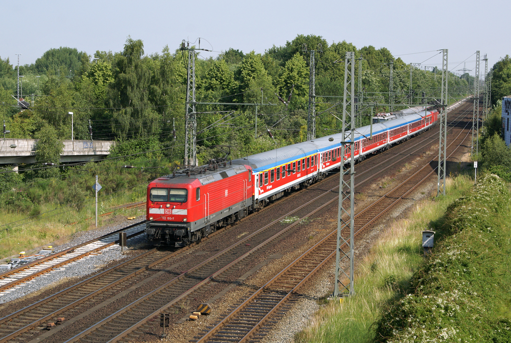 112 155-7 mit einem RE von Padborg nach Hamburg Hbf am 2.07.2010 in Elmshorn.
