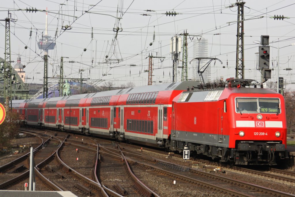120 208-4 am 12.3.11 mit dem RE 9 nach Siegen bei der Einfahrt in Kln Messe/Deutz