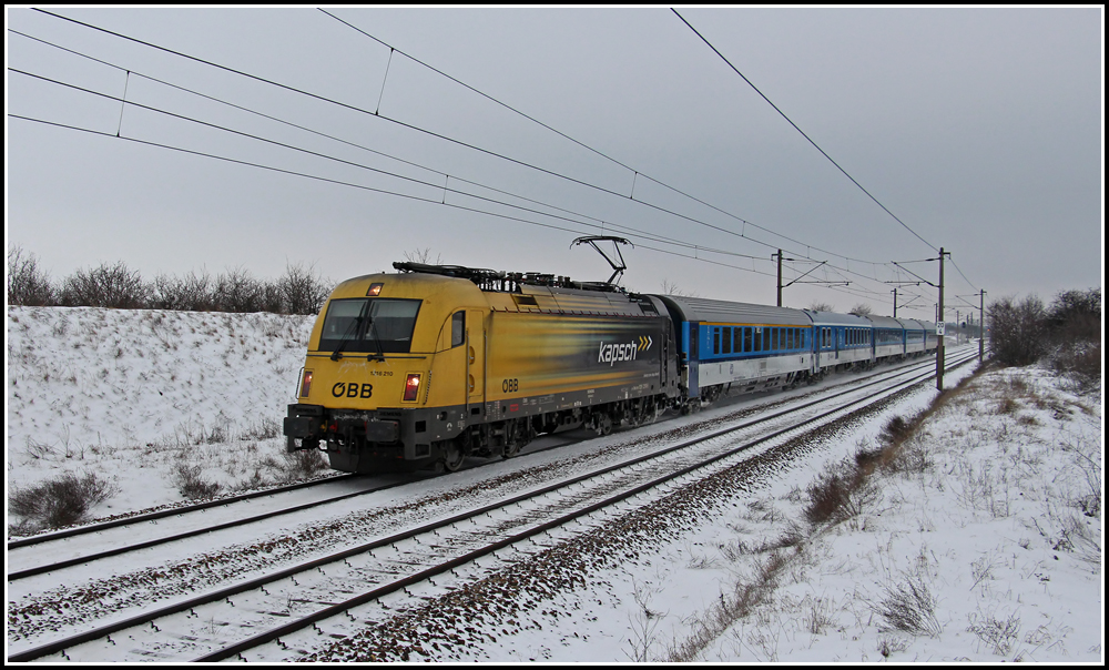 1216 210  Kapsch  mit EC 77  Antonin Dvorak  (Prag - Wiener Neustadt), aufgenommen am 12.02.2013 bei der Hst. Helmahof.