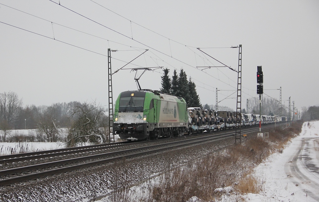 1216 954-8 mit MB Gelndewagen in Fahrtrichtung Norden. Aufgenommen am 17.01.2013 an der Nordeinfahrt nach Eschwege.