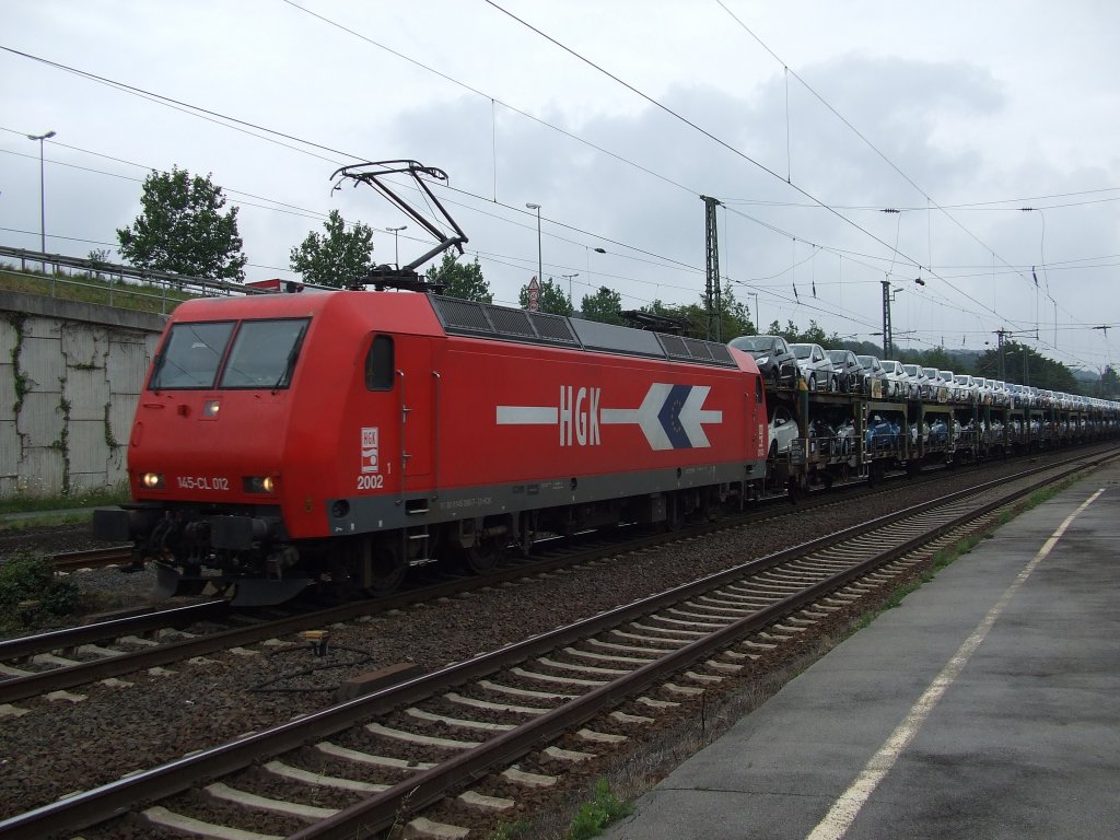145-CL 012 (145 090-7) durchfhrt mit einem Autozug den Brackweder Bahnhof. 21.07.2011.