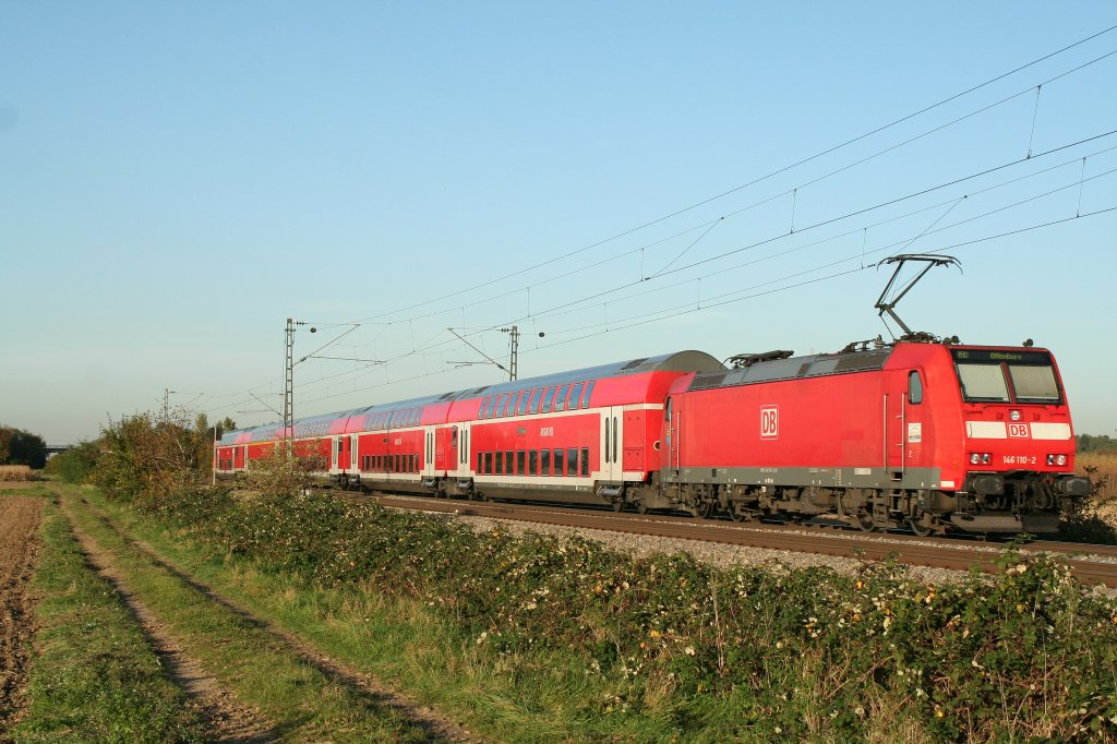 146 110-2 mi einem RE nach Offenburg am Abend des 19.10.12 bei Buggingen.