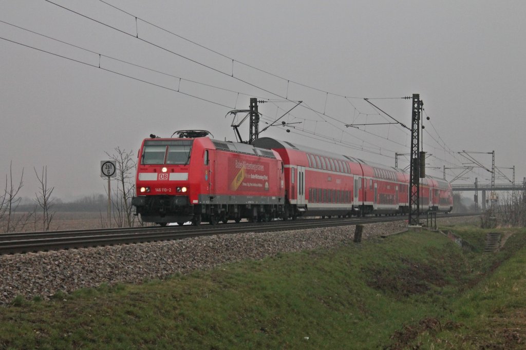146 110-2  Mllheim (Baden)  am 30.03.2013 mit einem RE nach Basel. Hier ist der RegionalExpress kurz vor dem nchstem Halt in Mllheim (Baden).