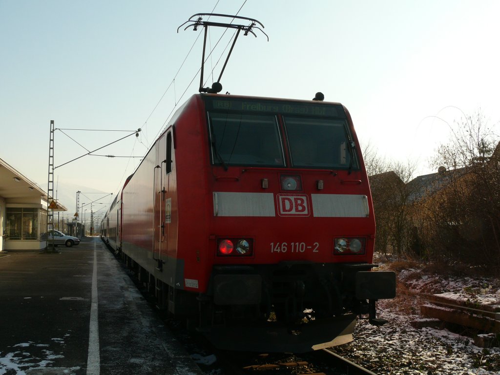 146 110 mit einer RB nach Freiburg, im Grenzbahnhof Neuenburg(Baden). 4.3.12