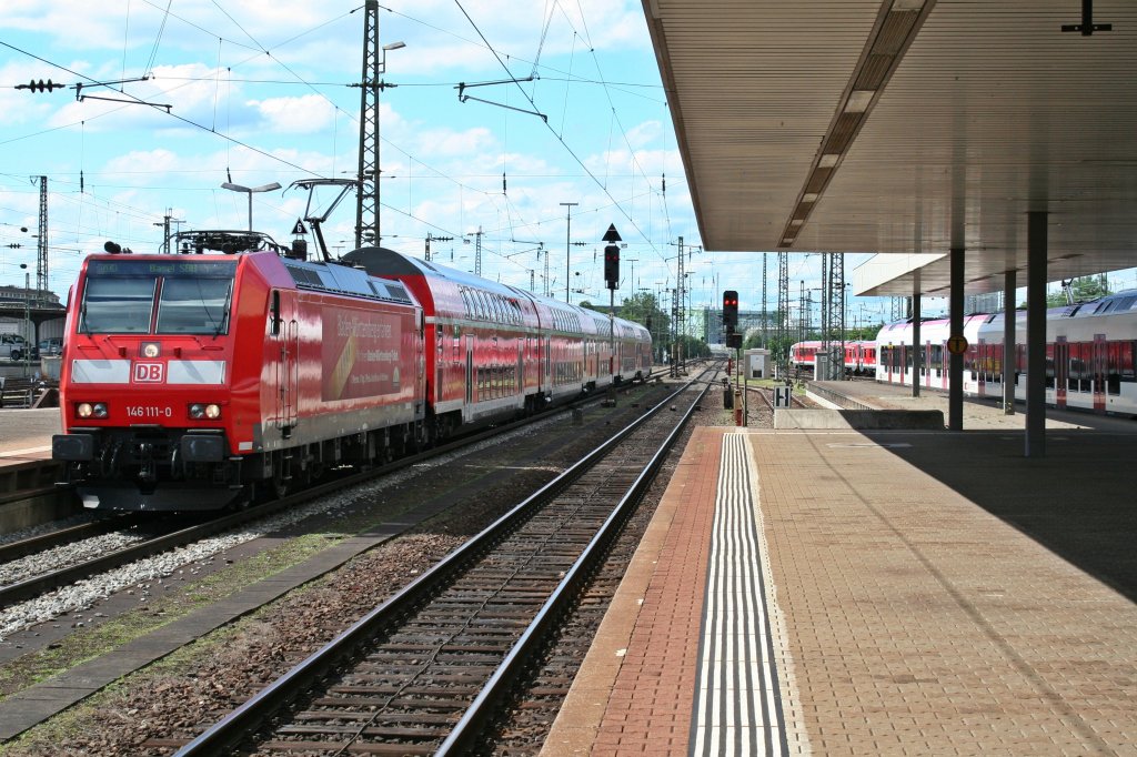146 111-0 mit dem RE 5341 nach Basel SBB am Nachmittag des 21.06.13 bei der Einfahrt in Basek Bad. Bf. Der Zug hatte an diesem Tag gut fnf Minuten Versptung.