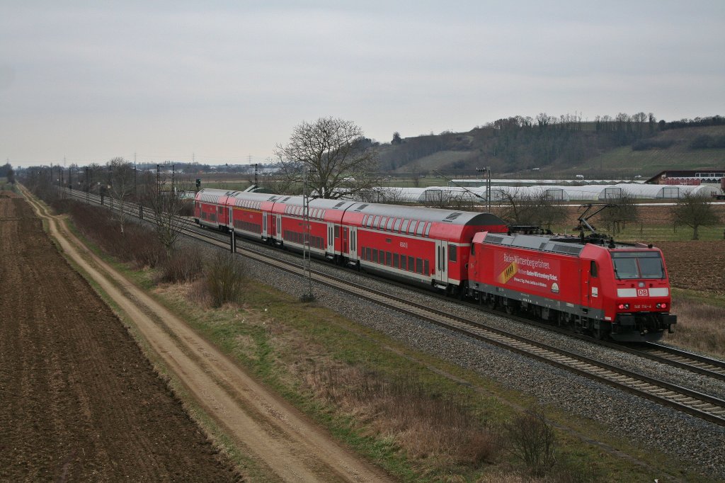 146 114-4 mit einem gut fnf Minuten verspteten RE nach Offenburg am 02.03.12 bei Hgelheim.