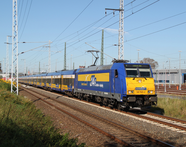 146 520-2 mit X 68904 von Warnem�nde nach Leipzig Hbf kurz nach der Ausfahrt im Rostocker Hbf.30.09.2011