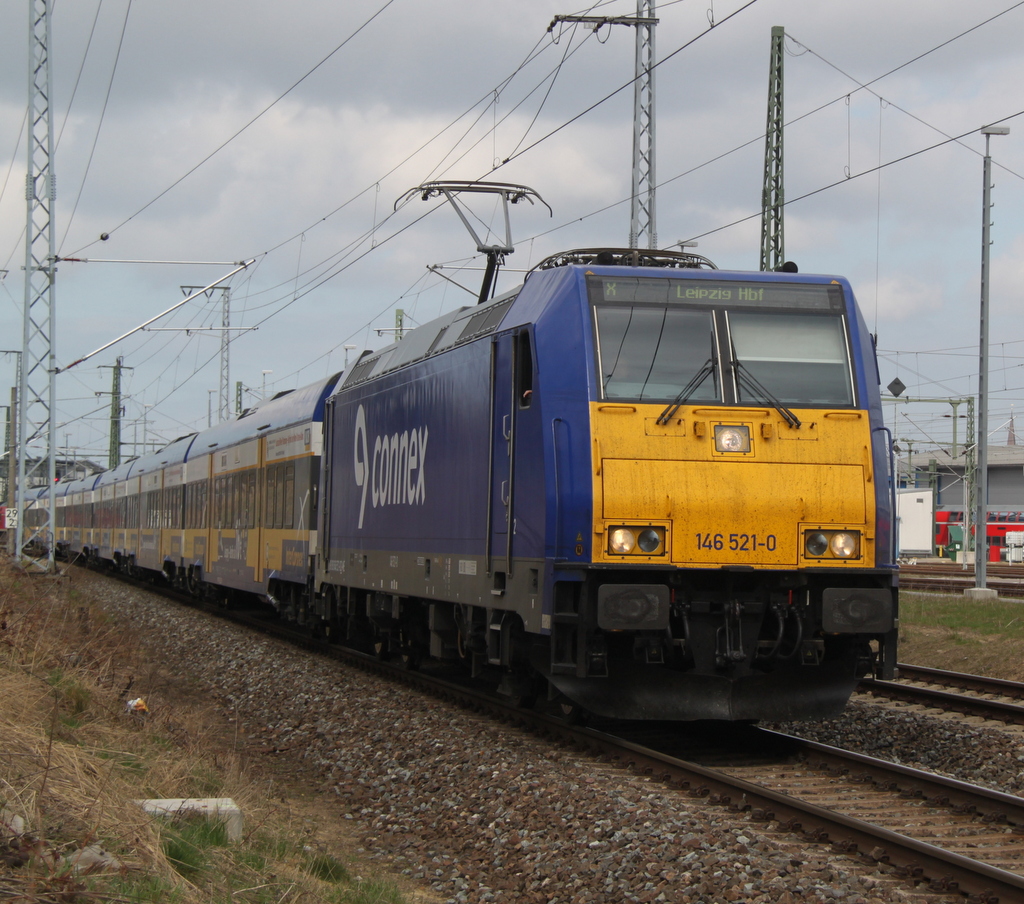 146 521-0 mit dem Interconnex(X 68904)von Warnemnde nach Leipzig Hbf bei der Ausfahrt im Rostocker Hbf.19.04.2013  