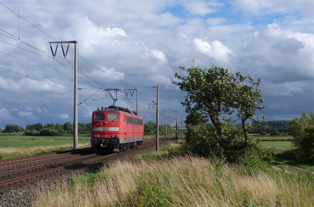 151 097-3 fuhr am 12.07.2012 als Lokzug von Emden nach Drpen, hier bei Veenhusen.