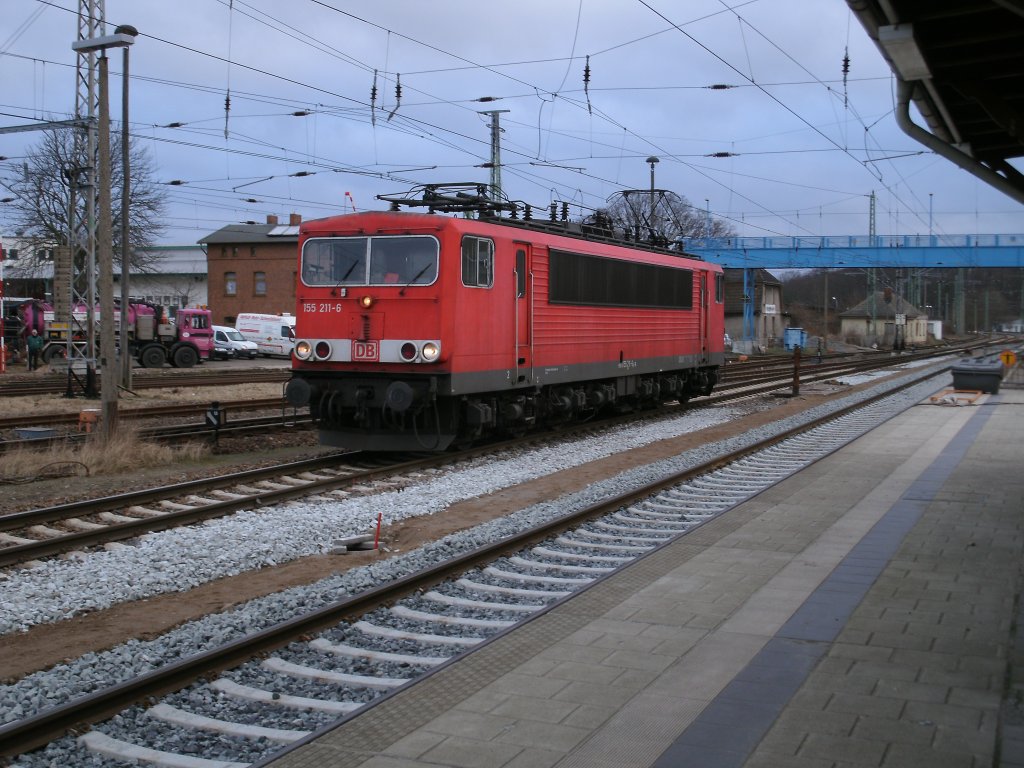155 211 kam am 09.Februar 2011 als Lz von Mukran durch Bergen/Rgen gefahren.