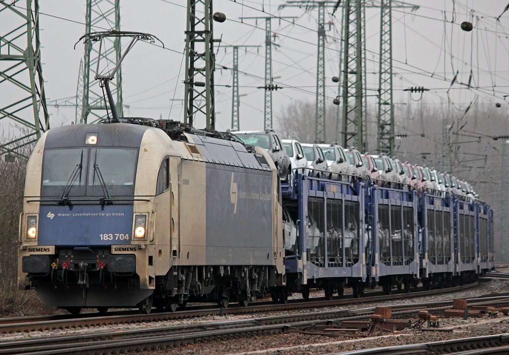 183 704 der Wiener Lokalbahnen mit Autozug in Gremberg am 18.02.2011