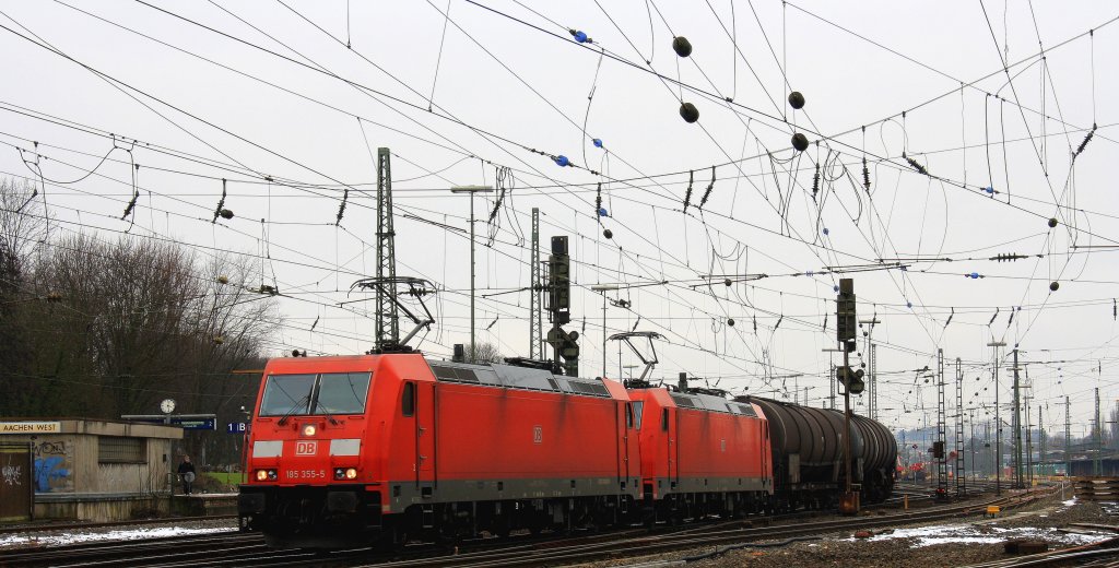 185 355-5 und 185 359-7 beide von der DB fahren mit einem langen lzug aus Antwerpen-Petrol(B) nach Basel(CH) bei der Abfahrt aus Aachen-West und fahren in Richtung Aachen-Hbf,Kln bei Wolken am 3.3.2013.