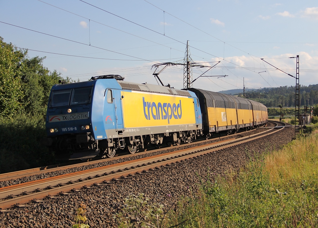 185 518-8 mit geschlossenen ARS-Autotransportwagen in Fahrtrichtung Norden. Aufgenommen zwischen Eichenberg und Friedland(HAN) am 12.07.2012.
