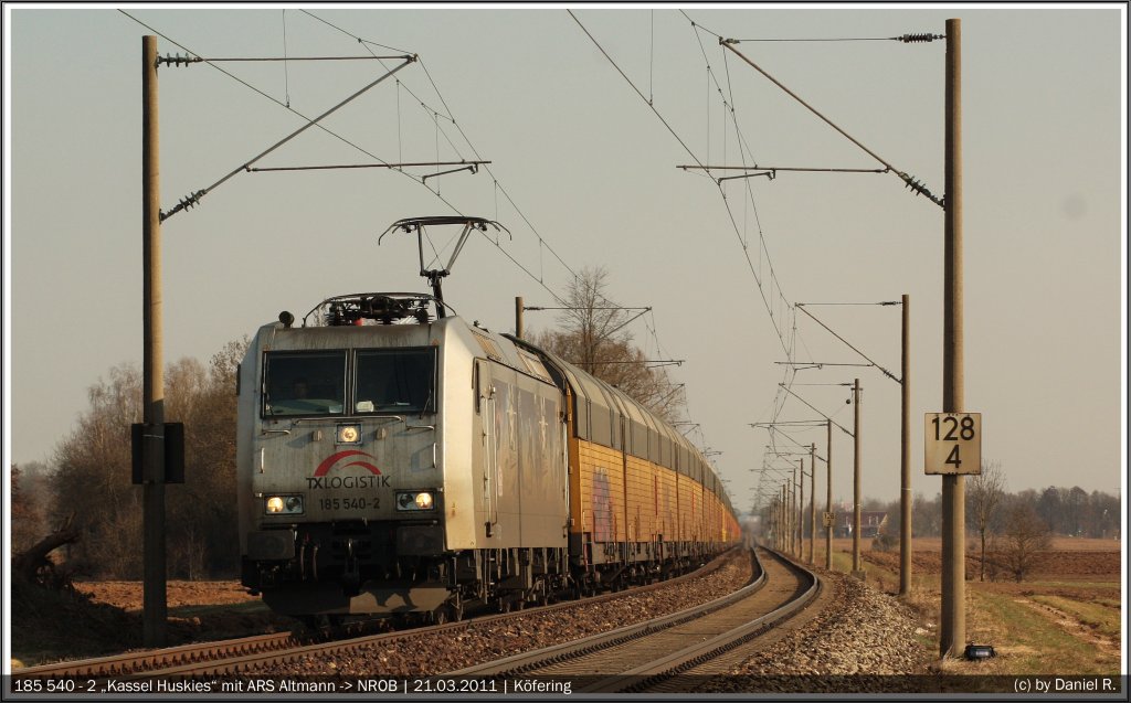 185 540  Kassel Huskies  mit dem ARS Altmann Zug von Landshut nach Bremerhafen kurz nach Kfering. (21.03.2011, Kfering)