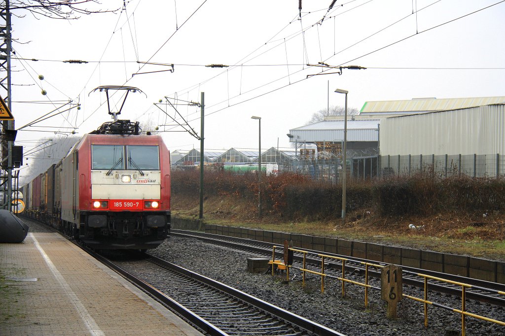 185 590-7 von Crossrail kommt als Umleiter aus Richtung Herzogenrath mit einem Containerzug nach Aachen-West.
Aufegnommen bei der durchfahrt in Kohlscheid. am 10.3.2012.