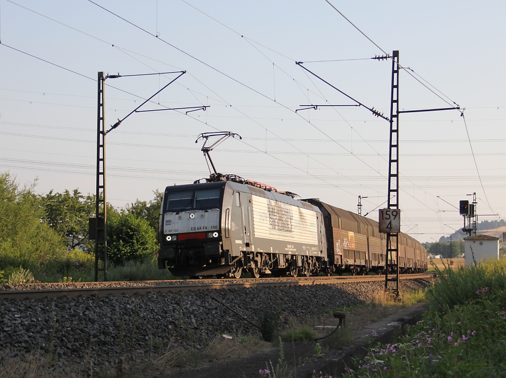 189 150 (ES 64 F4-150) mit geschlossenen ARS-Autotransportwagen in Fahrtrichtung Norden. Aufgenommen zwischen Ludwigsau-Friedlos und Mecklar am 25.07.2012.