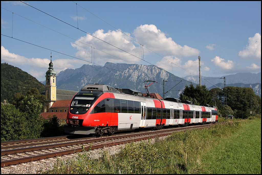 4024 075 ist als RB 5122, Telfs-Pfaffenhofen – Rosenheim, beim Kloster Raisach unterwegs.  (06.08.2009)