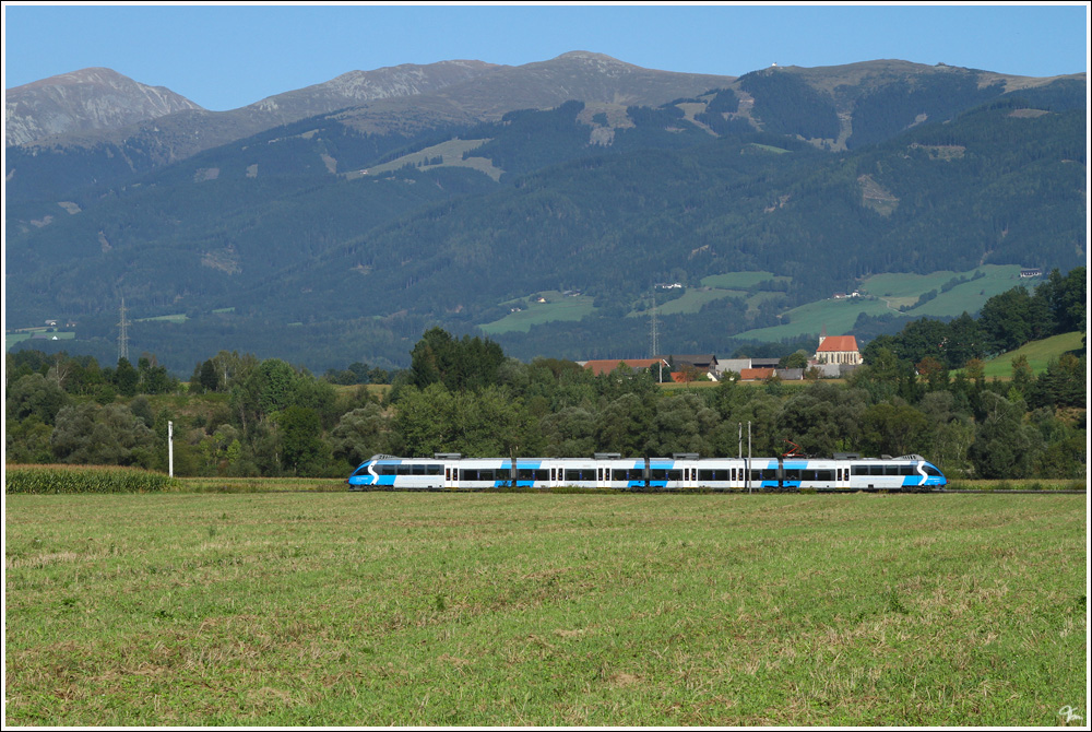 4024 120 fhrt als R 1702 von Friesach nach Mrzzuschlag.Im Hintergrund sieht man die Kirche von St.Marein. 
13.9.2011