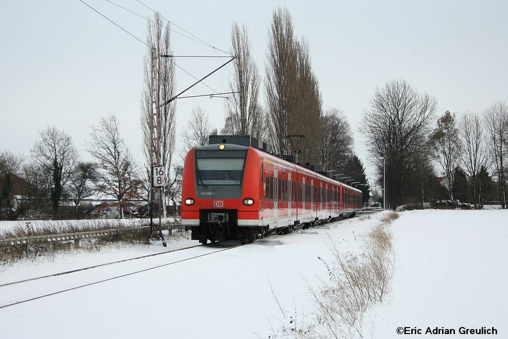 424 003 mit 424 040 am 10.12.2010 kurz hinter Winninghausen.